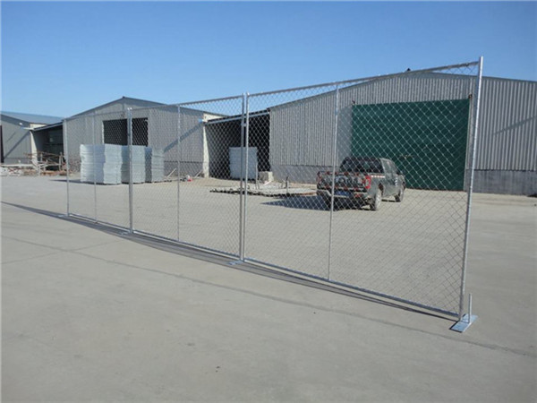 temporary chain link fence installed with flat stee stands