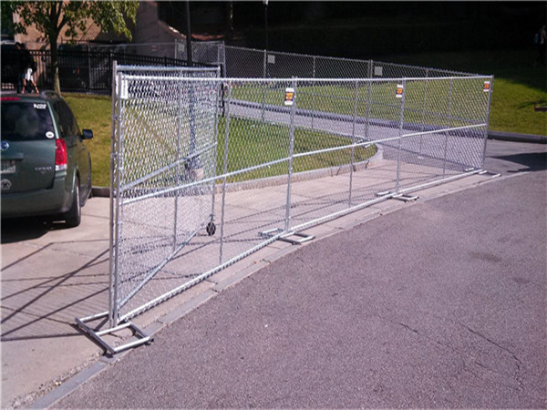 Temporary chain link fence installed around parking lot