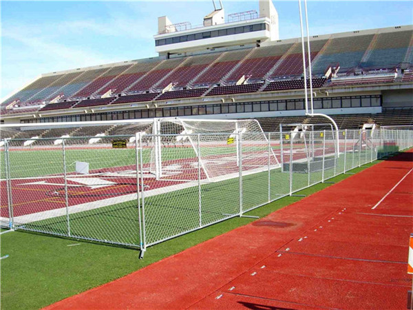 Temporary chain link fence installed around the sports