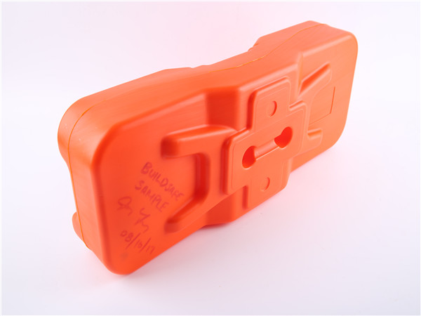 Orange plastic temporary fence feet with vertical hole