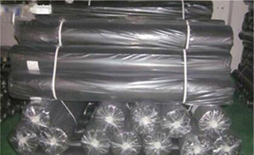 a picture of black sediment fence packed in rolls