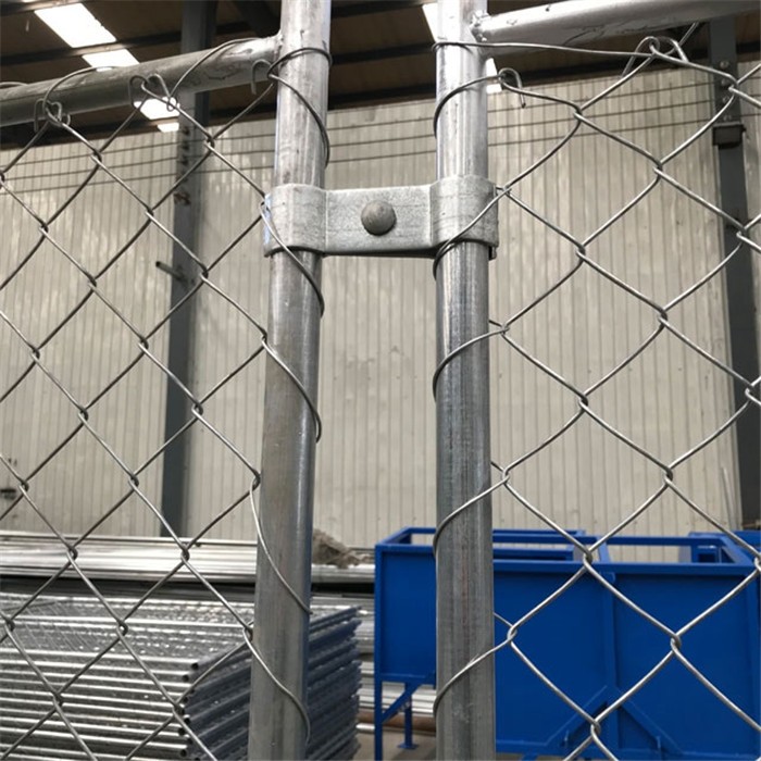 the steel clamps connected two temporary chain link fences