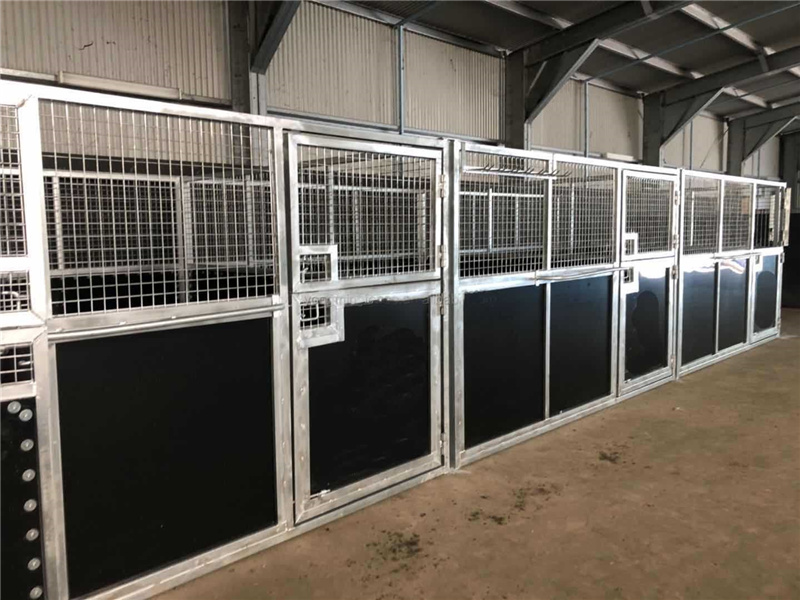 The galvanised horse stables installed in a barn