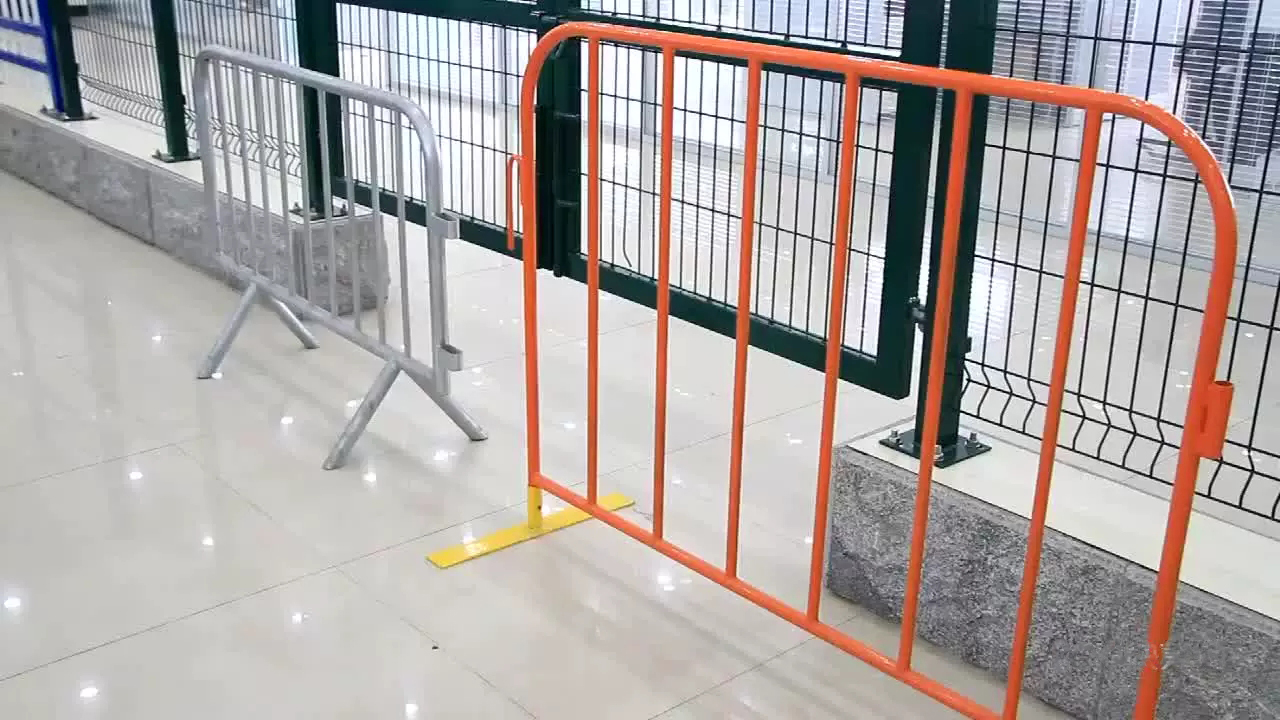 galvanized and orange crowd barrier