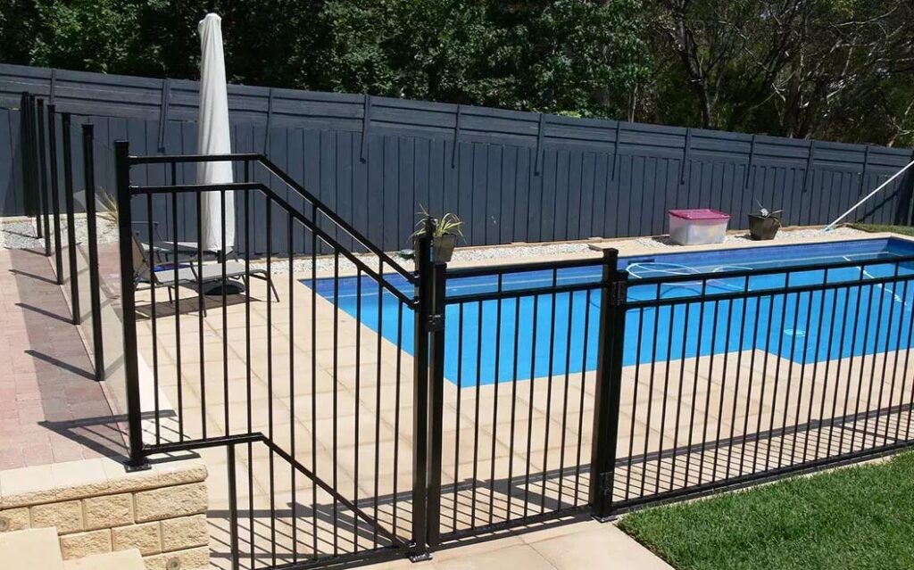 Powder coated black privacy fence around pool