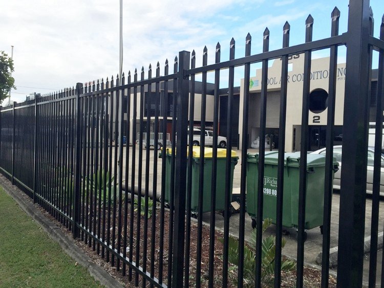 steel picket fence bunnings around a plant