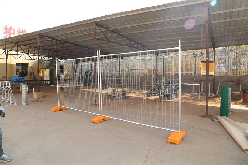 temporary fence panels installed with feet and clamps