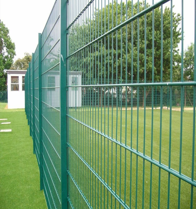 The powder coated green double wire fence with post installed in playground.