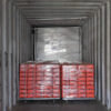 The temporary fence panels and plastic feet are loaded into container