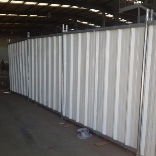 The whitc color temporary hoarding panels installed in our workshop.