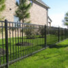 The powder coated black metal fence panel around a house