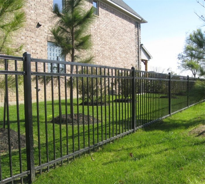 The powder coated black metal fence panel around a house