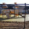 The corrugated metal panel fence installed around a kindergarten.