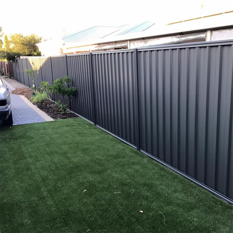 The steel colorbond fencing around a house