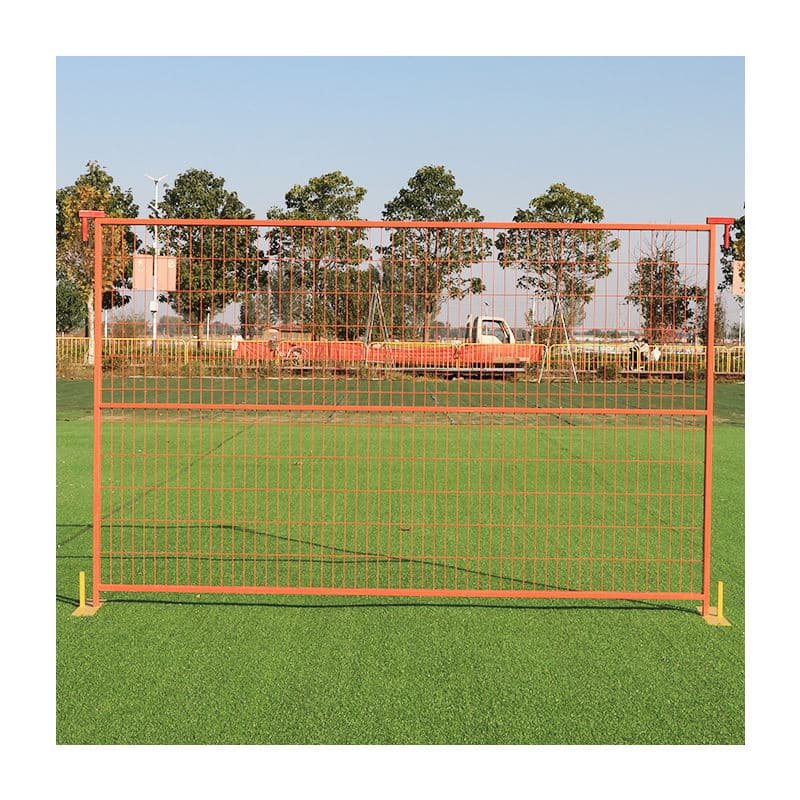 The powder coated orange temporary fence in the playground.