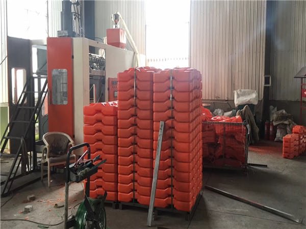temporary fence feet producing machine with products in our factory.