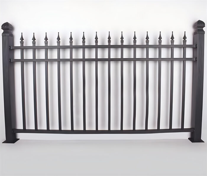 A decorative black aluminum spear top fence panel with finials and an ornamental design at the top.