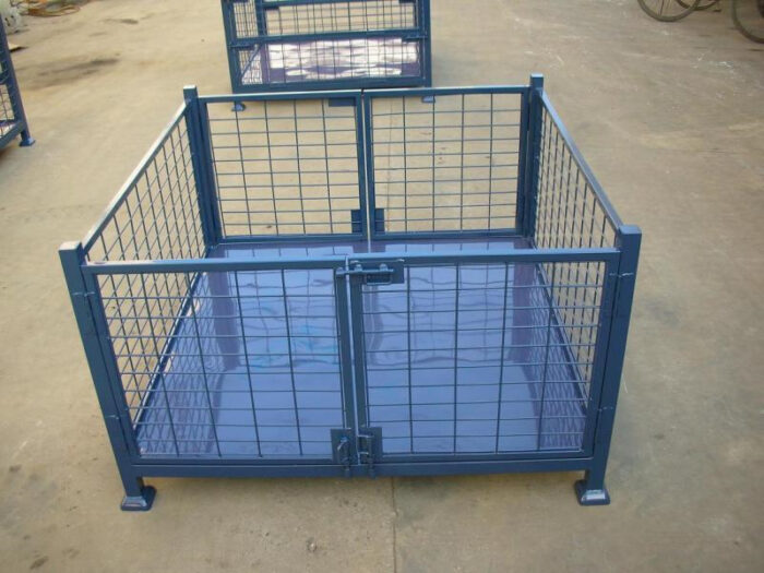 Blue steel stillage cage with double swing doors, placed in an outdoor storage area.