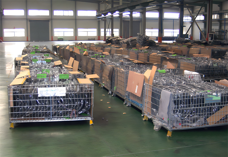 Industrial warehouse filled with multiple stacked stillage cages containing various goods.