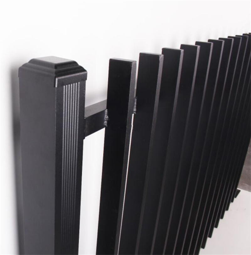 Side view of a black aluminium fence post with decorative details, connected to the vertical blade slats.