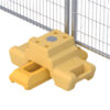 Yellow DB Fencing ballast block securely holding a temporary fence in place.