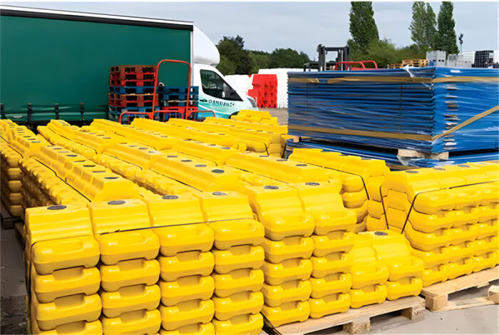 Many of the yellow heras step blocks are packaged in pallets.