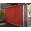 Australian orange construction barrier stands on the factory.