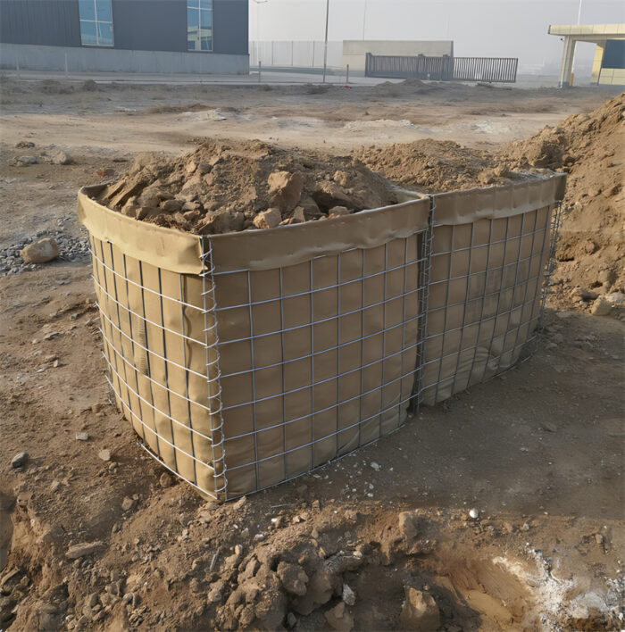 A partially filled Hesco barrier positioned at a construction site.