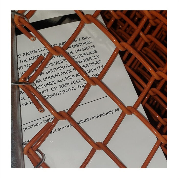 The chain link mesh of orange barrier