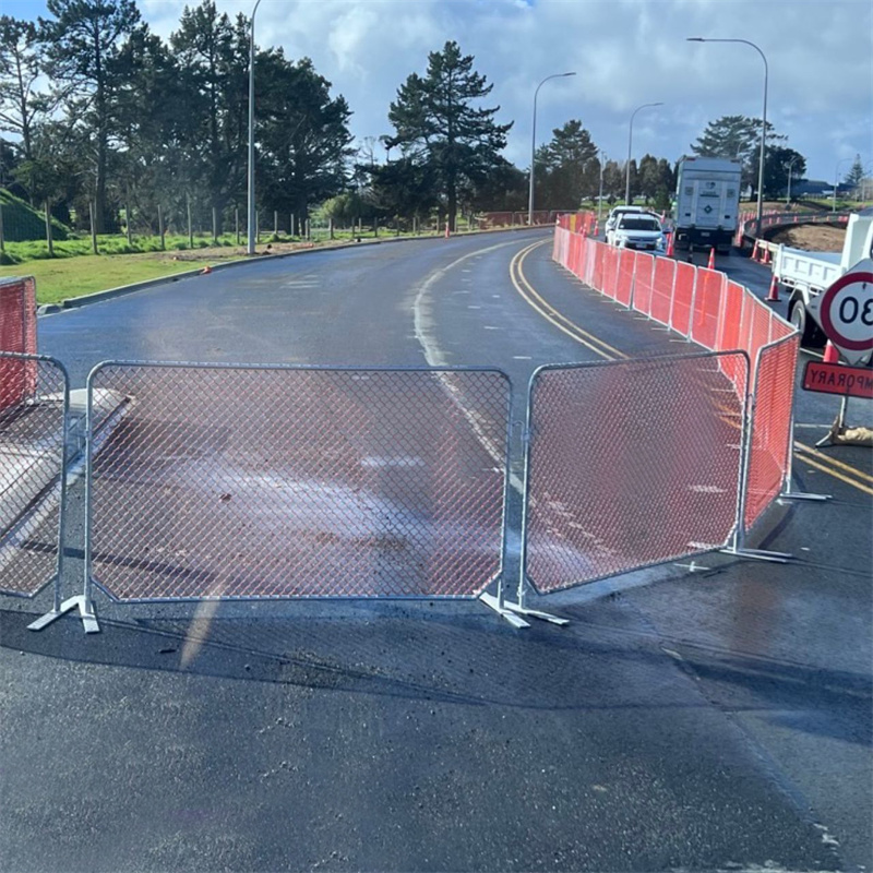 orange mesh barriers connected in site.