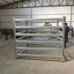 Well-structured cattle yard panels displayed in a factory setting for quality assurance.