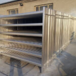 High-quality square tubing cattle panels stacked for transport, showcasing their durability and smooth galvanised finish, designed for long-lasting livestock containment.