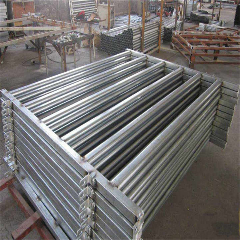 Close-up of stacked galvanized bull panels prepared for shipment and installation.