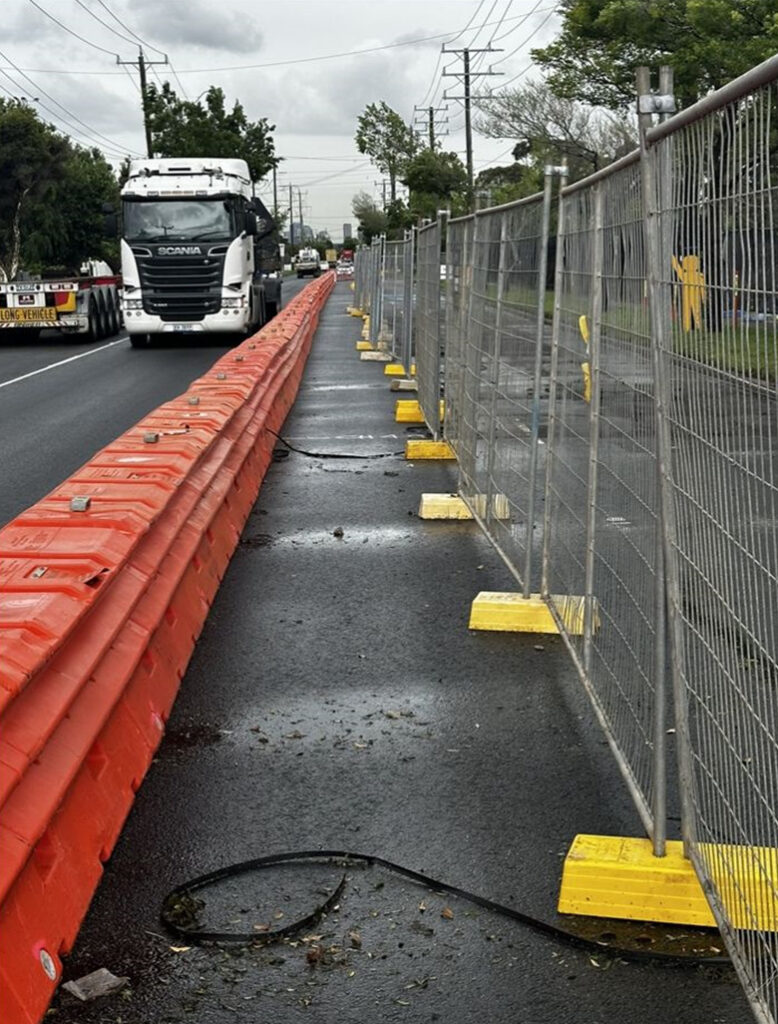 Portable fencing installation at a waterfront location, providing safety and security around a marina