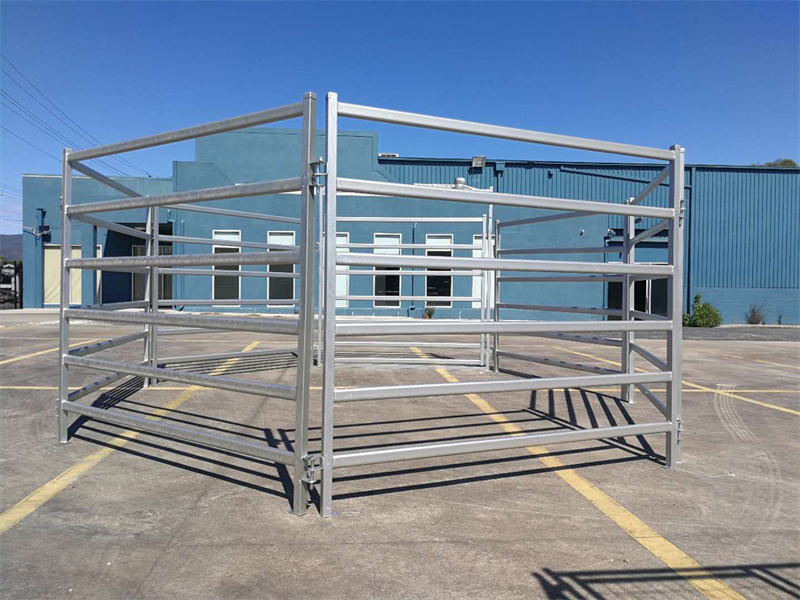 Steel horse panels arranged in a square configuration, ready for assembly in an equestrian facility.