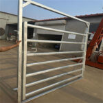 Heavy-duty galvanized horse gate being held by a person, designed for durability and security in horse fencing.