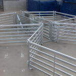 Various portable sheep yard panels arranged in an efficient layout for easy handling and sorting of livestock, demonstrating versatility and utility.