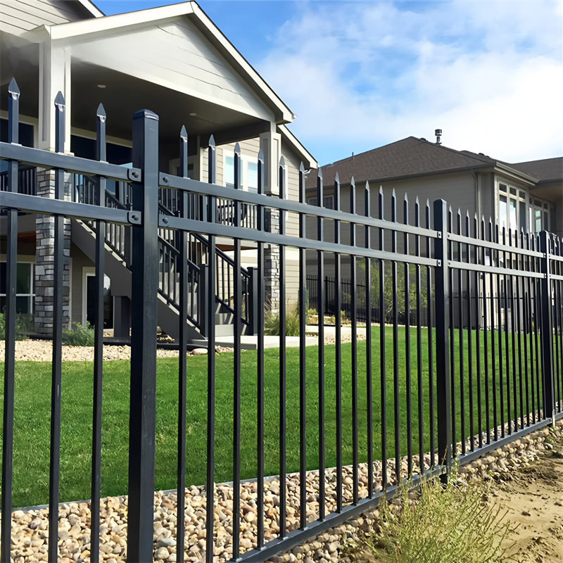 Example of a galvanized steel picket fence installation around a residential property, highlighting aesthetic appeal and security.