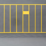 Yellow powder-coated crowd control barrier with a durable flat foot base, designed for high visibility and long-term use.