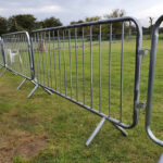 A comprehensive view of a steel barricade in an outdoor area, with close-up images of its components, including the connector and base plate.