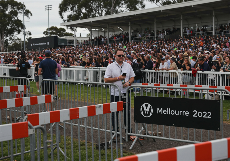 Crowd control barricades used at a large outdoor event, effectively managing pedestrian movement and ensuring safety for attendees.