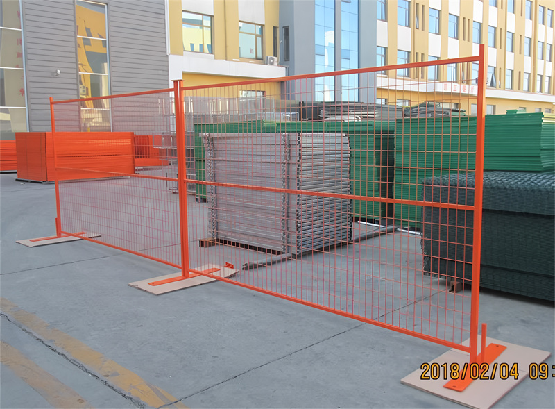 Orange temporary fence panels in an outdoor setting, demonstrating versatility for various projects.