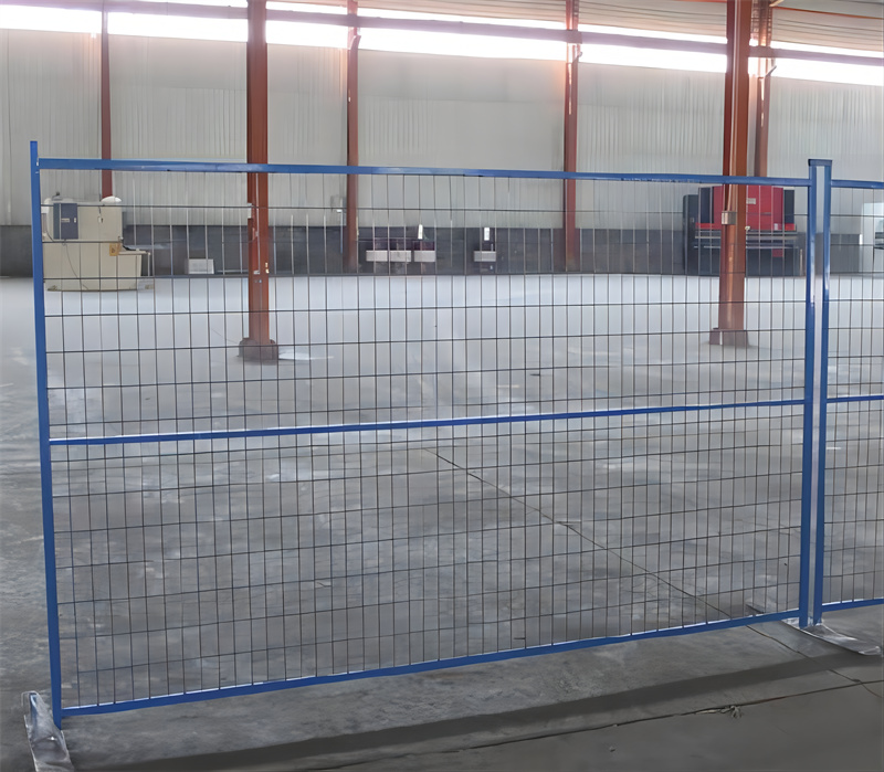 Installed blue temporary fence in an industrial setting, demonstrating its application for site security and crowd control.