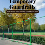 A promotional image titled 'Temporary Guardrails' featuring a line of green temporary fence panels with green bases along a paved area next to trees with yellow leaves under a blue sky.