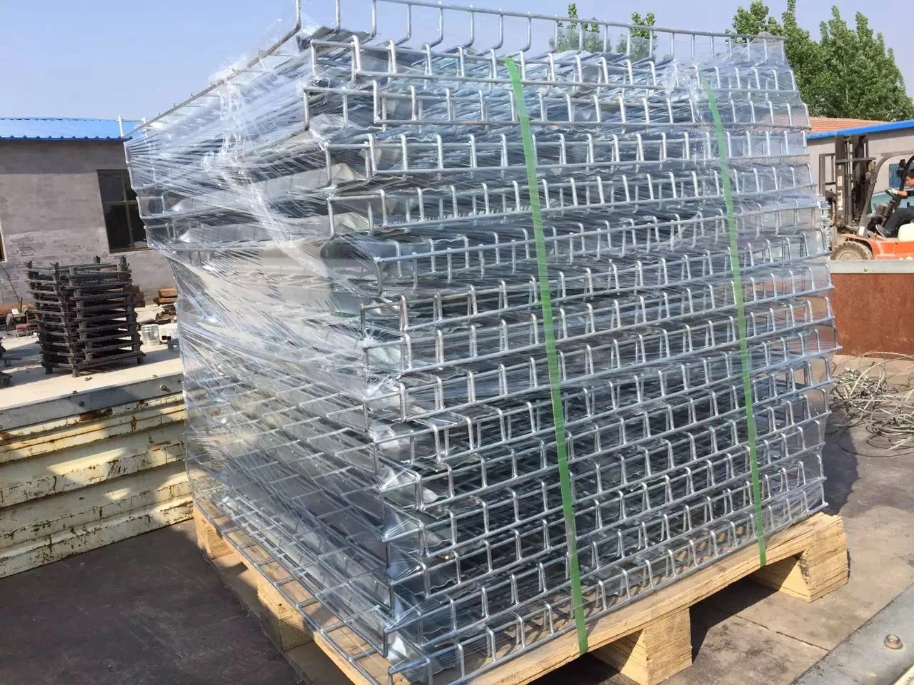 Hot-dip galvanised BRC fence panels bulk packaged on pallets ready for export by the manufacturer