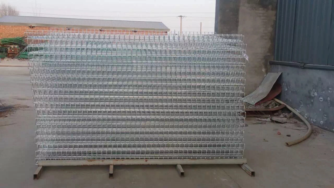 Stack of galvanized BRC fence panels manufactured by DB Fencing, a leading Anping-based wire mesh exporter with 14 years of experience, showcasing durable hot-dipped galvanized finishes for construction, agricultural, and event management applications.