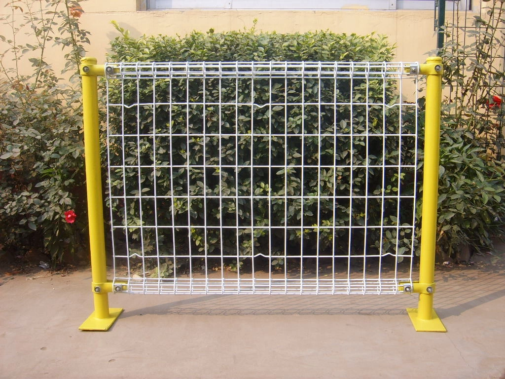 DB Fencing's BRC temporary wire mesh fence with bright yellow powder-coated posts and hot-dipped galvanized white mesh, designed for construction sites, events, and outdoor security.