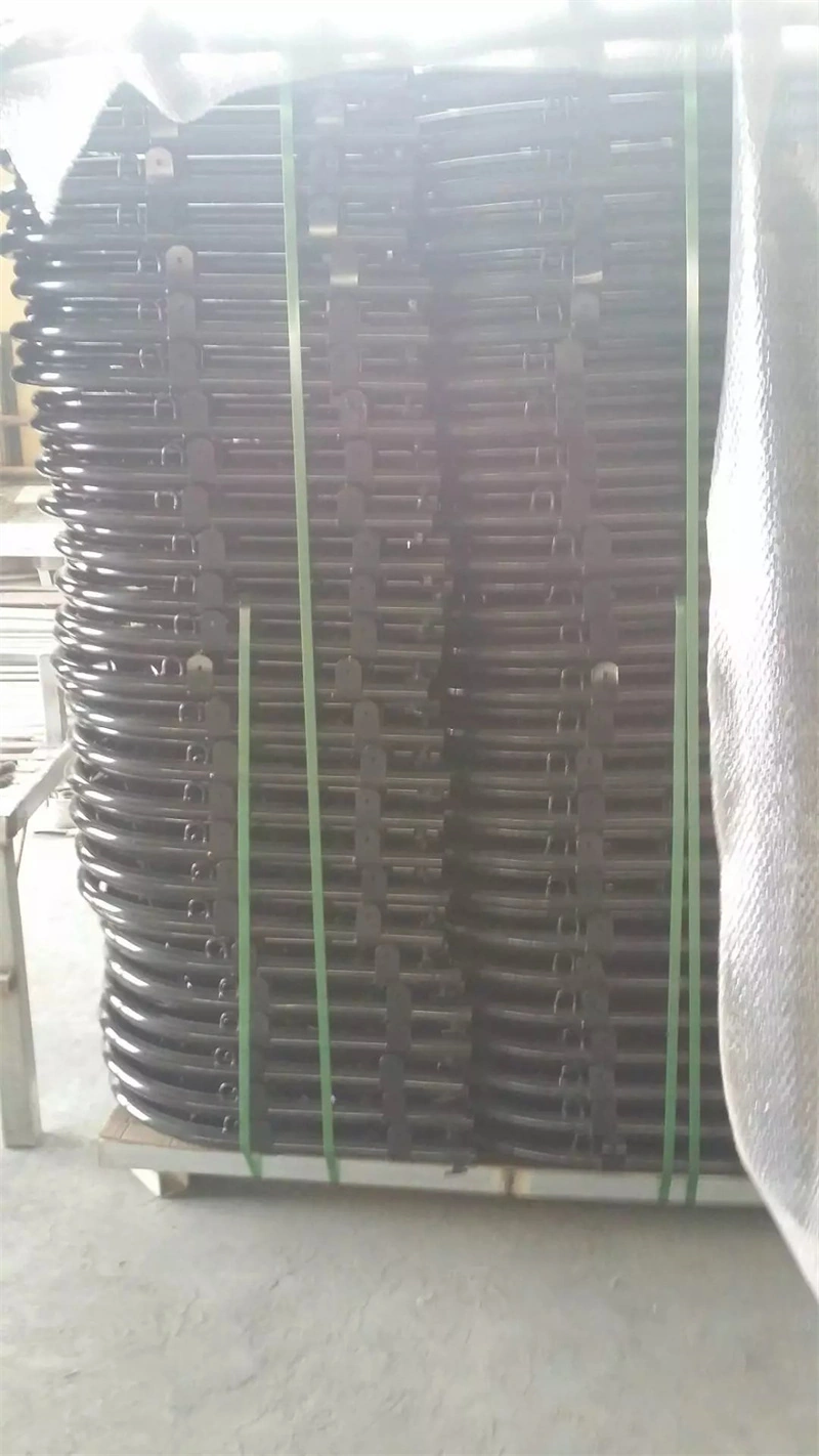 Stack of black metal crowd control barrier panels secured with green straps on a pallet, representing DB Fencings bulk manufacturing of durable, AS4687-compliant fencing solutions for construction and event management clients.