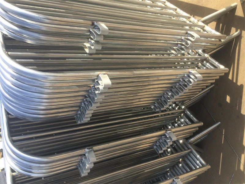 Stacked galvanized steel crowd control barrier components from DB Fencing, featuring hot-dipped galvanized finish for durability in harsh outdoor environments, ideal for construction sites and event crowd control.