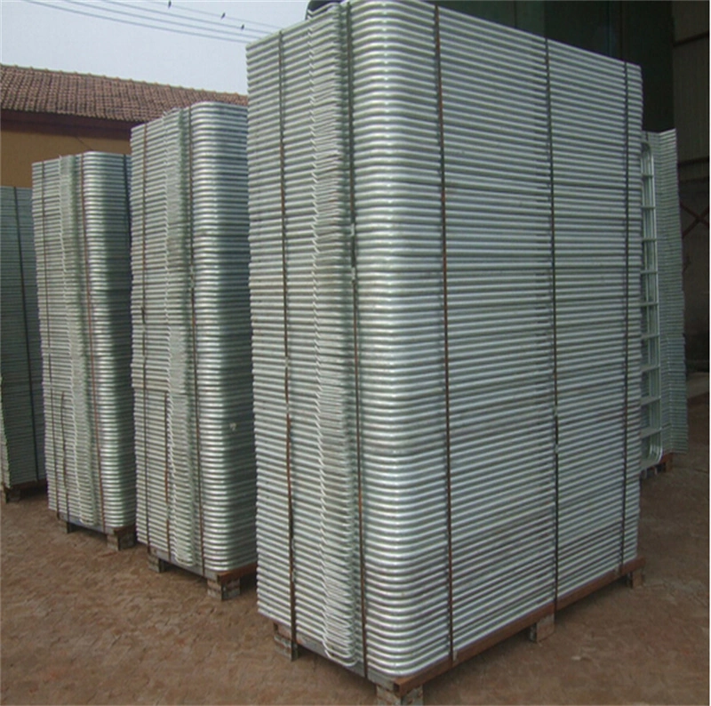 Stacks of DB Fencing's galvanized steel crowd control barrier panels, featuring corrugated metal design, stored on wooden palletsengineered for long-lasting outdoor use in construction sites, events, and agricultural applications, with hot-dipped galvanized finish for corrosion resistance.